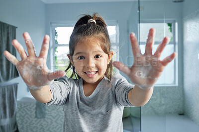 Buy stock photo Portrait, girl child and washing hands with soap for health, development and bacteria or dirt removal in home. Young kid, palm and foam bubbles for cleaning, learning hygiene and growth in bathroom