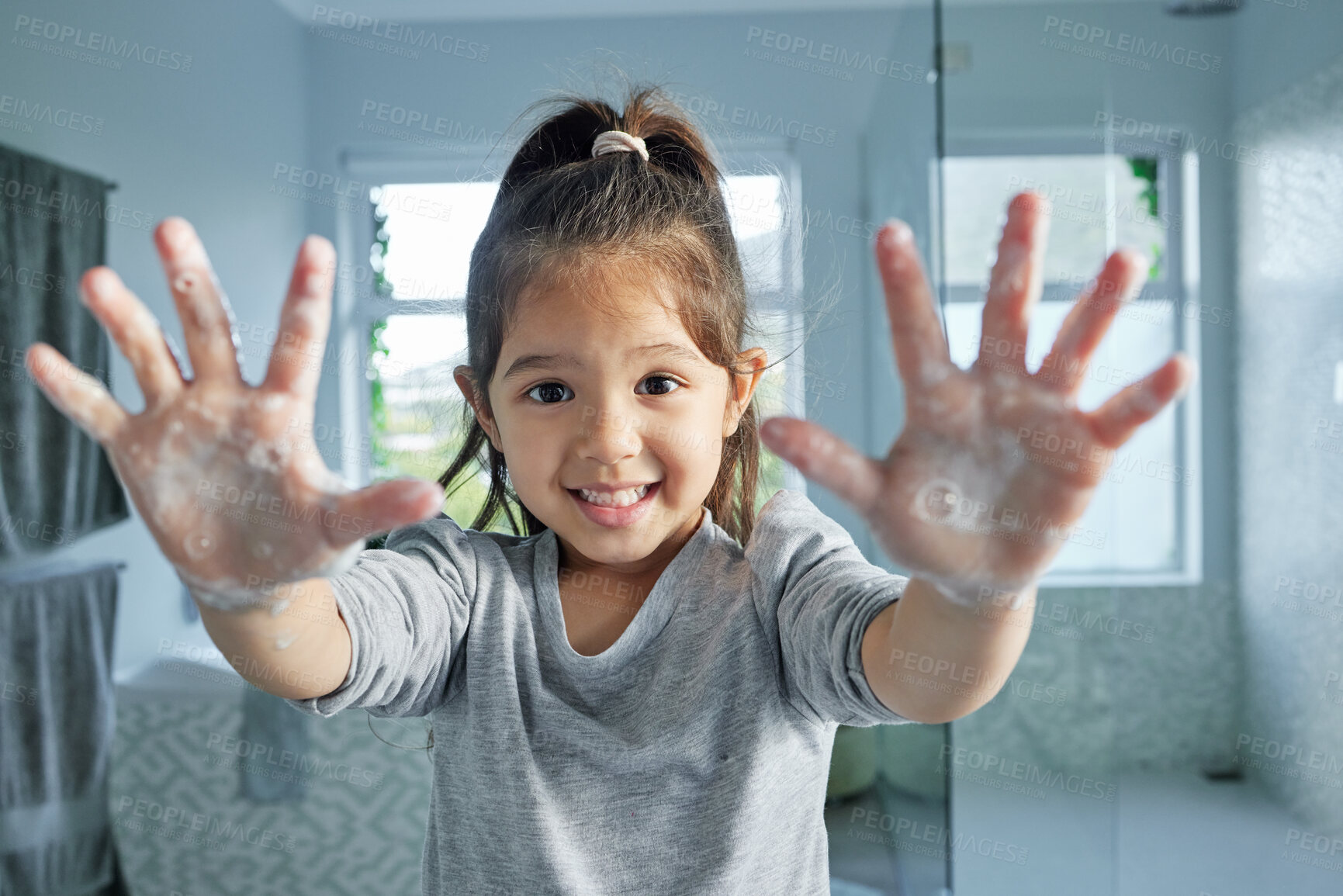 Buy stock photo Portrait, girl child and washing hands with soap for health, development and bacteria or dirt removal in home. Young kid, palm and foam bubbles for cleaning, learning hygiene and growth in bathroom