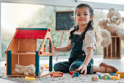 Buy stock photo Girl, dollhouse and child play in portrait, games and fantasy for brain development in home. Female person, toys and blocks on floor for entertainment, growth and toddler for education or learning