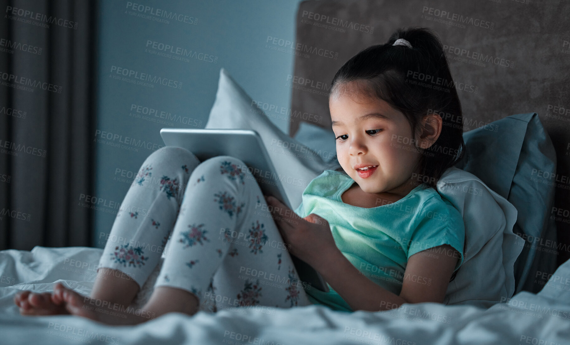 Buy stock photo Online, tablet and child on bed at night for education, learning or language development. Digital, reading and asian girl with ebook subscription for information, literacy or knowledge in home