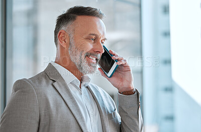 Buy stock photo Shot of a businessman on a call at work in a office