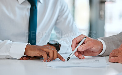 Buy stock photo Shot of two unrecognizable males signing a contract in a office