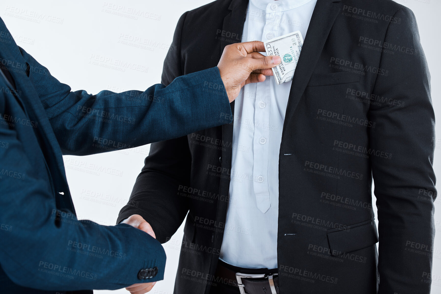 Buy stock photo Money in pocket, handshake and business people in studio for theft, bribery and financial corruption. Corporate, crime and workers with cash for secret payment, blackmail and fraud on gray background