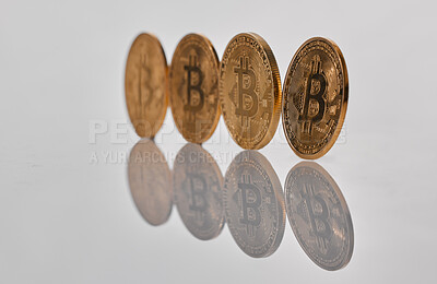 Buy stock photo Studio shot of a few coins against a grey background