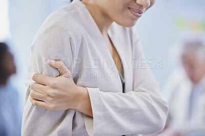 Buy stock photo Cropped shot of a businesswoman holding her arm in pain