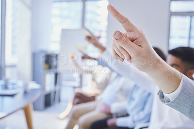 Buy stock photo Cropped shot of a group of businesspeople raising their hands during a meeting
