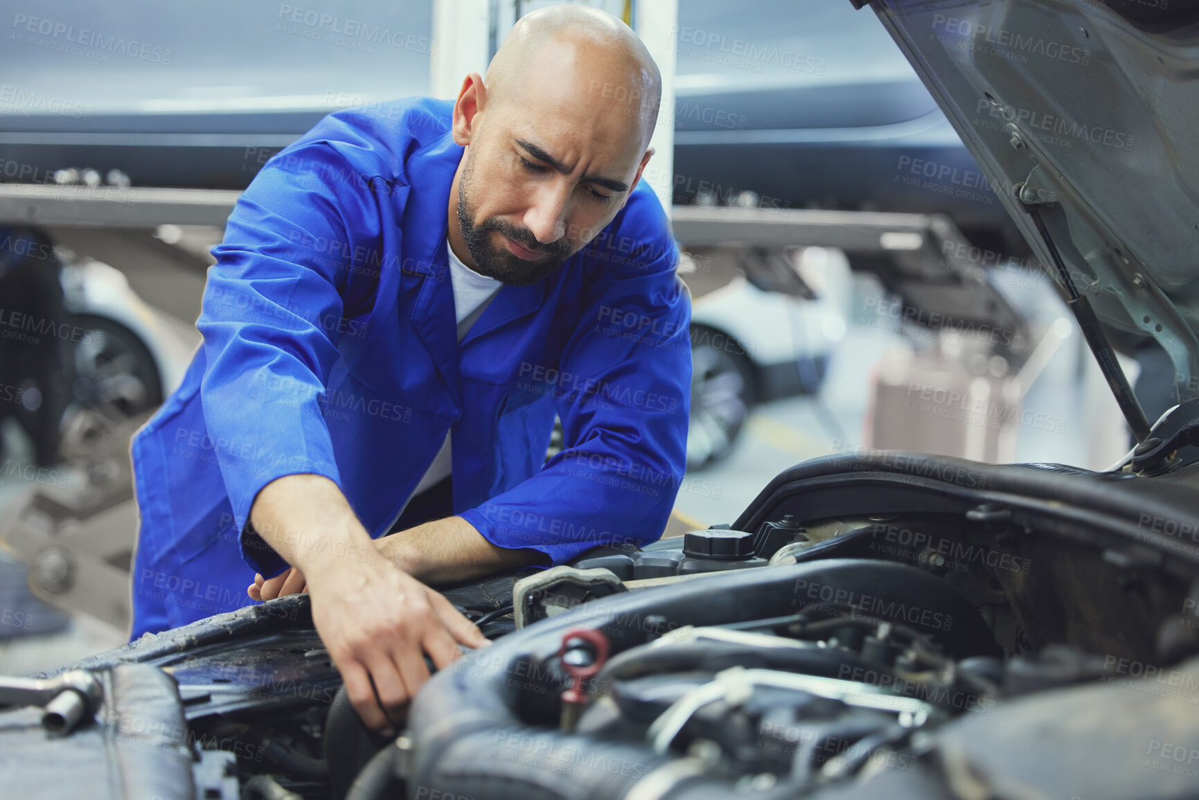 Buy stock photo Mechanic, motor or man fixing car in service garage for transportation industry or inspection test. Check, auto engineering and repairman working on vehicle for maintenance or manufacturing parts