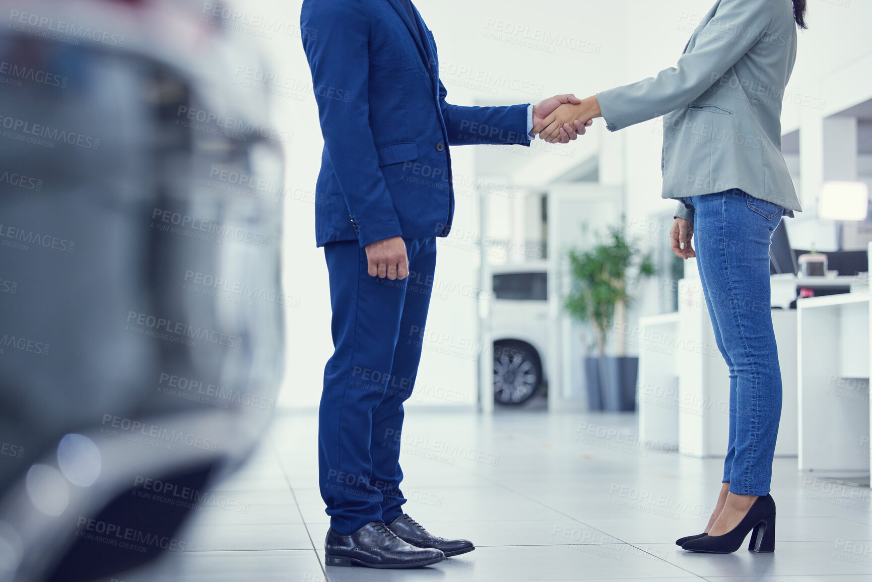 Buy stock photo Closeup, man and woman with handshake, collaboration and customer with negotiation, car dealership and selling. Zoom, business people or client shaking hands, agreement and professional with contract