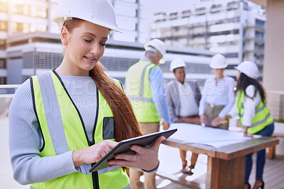 Buy stock photo Woman, tablet and construction with team, planning and smile for building with clipboard. Architect, engineer and safety helmet for collaboration, teamwork and affirmative action in industrial job