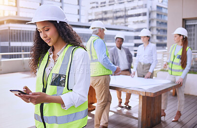 Buy stock photo Woman, cellphone and construction with team, planning and smile for building with clipboard. Architect, engineer and safety helmet for collaboration, teamwork and affirmative action in industrial job