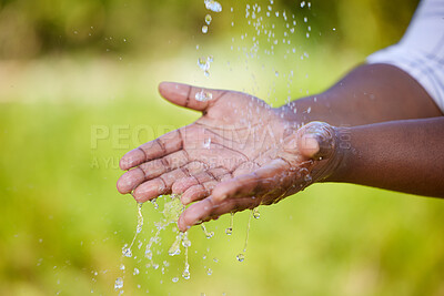 Buy stock photo Hands, hygiene and water outdoor for clean with grass, protection and safety from bacteria. Black person, palm zoom and wet by nature for germ prevention, sanitation and sustainability with green