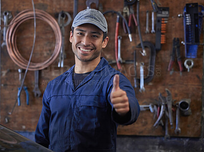 Buy stock photo Mechanic, man and portrait in workshop or thumbs up, repair garage and automotive engineering for car maintenance. Professional, vehicle service and motor issues, confident employee and coveralls