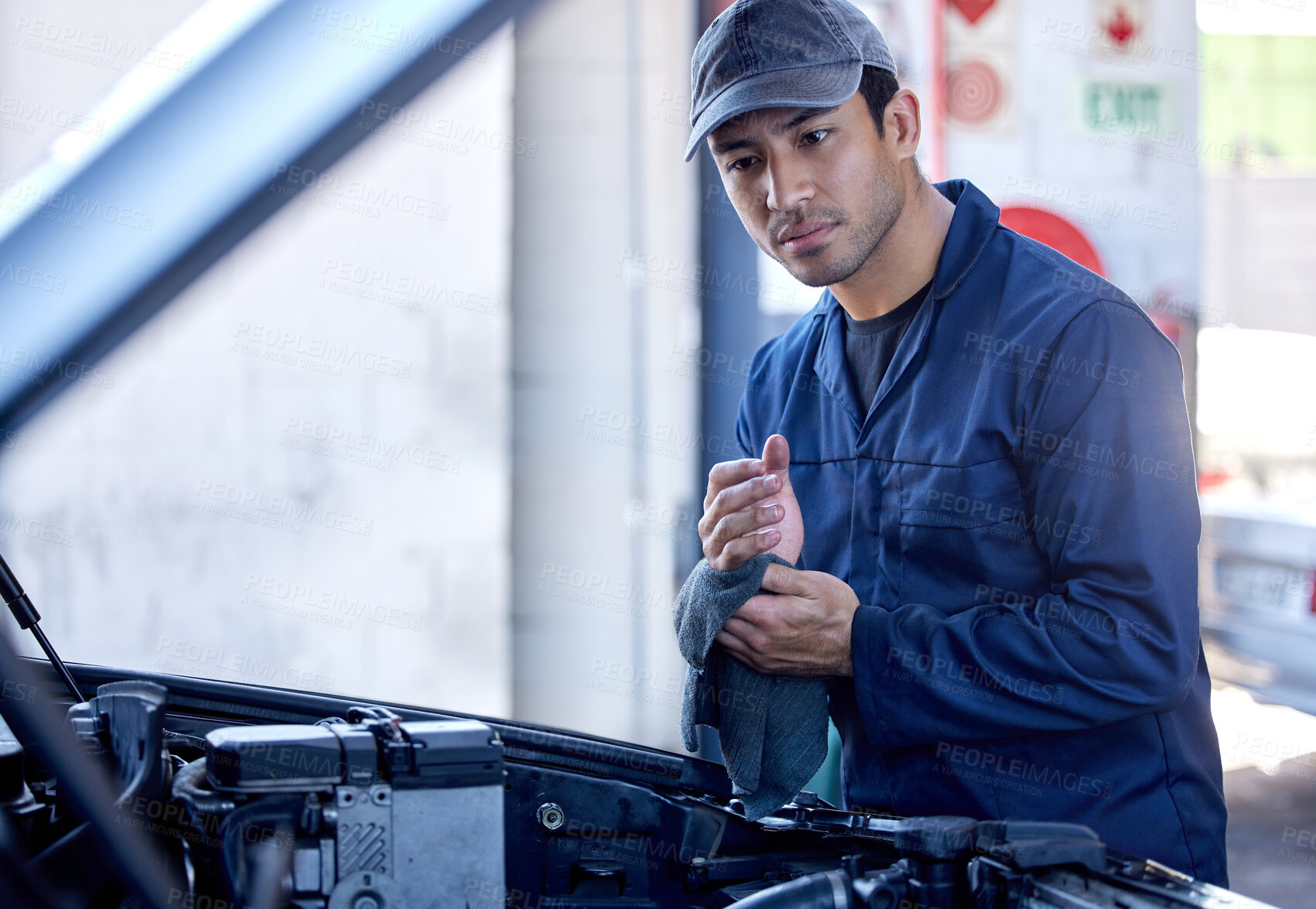 Buy stock photo Man, check and engine with cloth for service in garage, workshop or maintenance on car. Male mechanic, auto and inspection for problem with oil or motor, technician with knowledge on transport