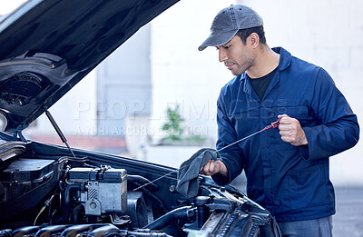 Buy stock photo Man, inspection and engine with cloth for oil in motor, workshop or maintenance on car. Male mechanic, auto and check for problem or service in garage, technician with knowledge on transport