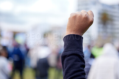 Buy stock photo Unrecognisable demonstrators holding up their fists in protest