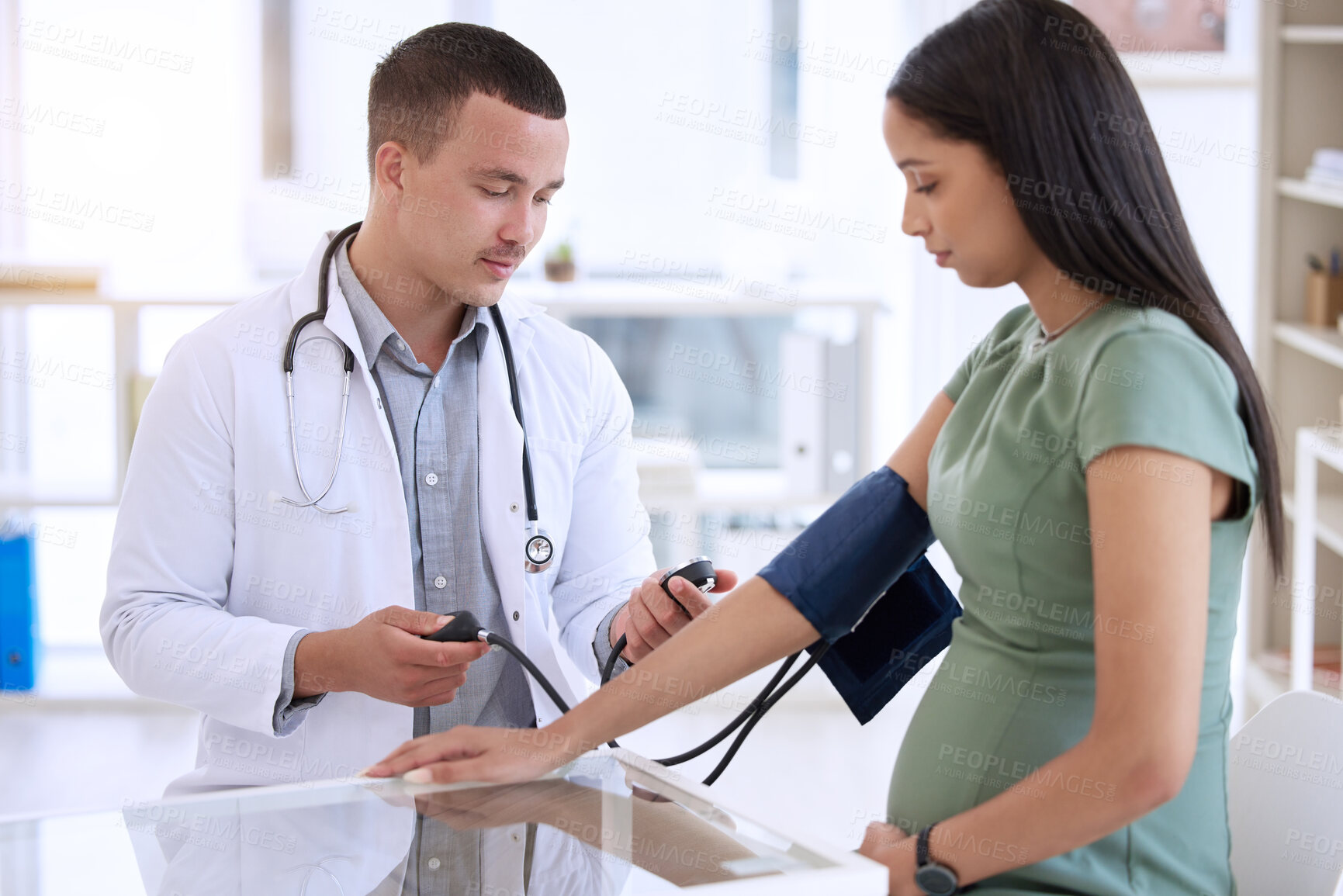 Buy stock photo Doctor, man and pregnant woman in clinic for blood pressure, healthcare checkup and consultation. Male medical expert, pregnancy and patient with hypertension in office for preeclampsia and wellness