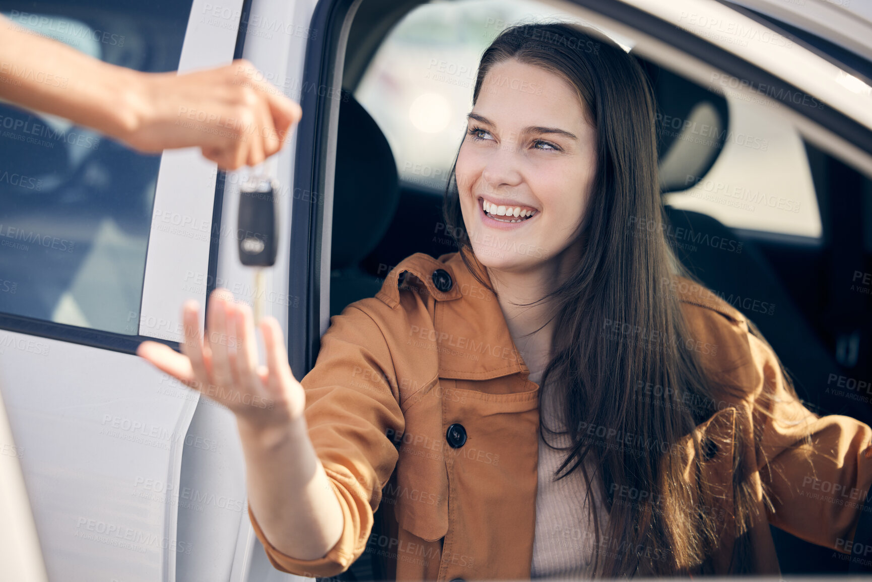 Buy stock photo Shot of a person handing a woman the keys to her new car outside