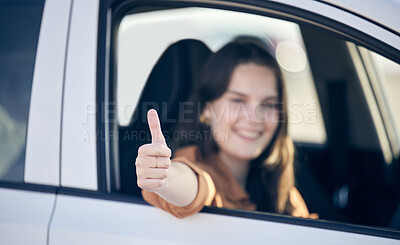 Buy stock photo Shot of a female showing thumbs up while siitng in a car