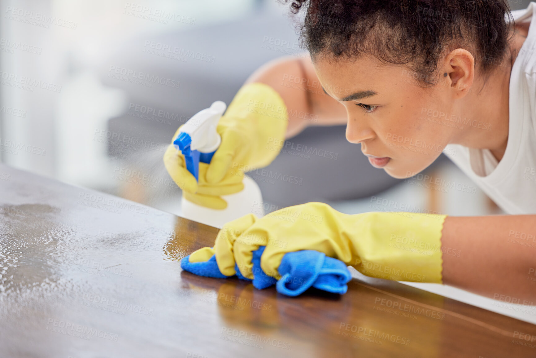 Buy stock photo Woman, cleaning and spray bottle on table in home, maid and chemical disinfection for hygiene. Female person, dust and fabric or cloth to tidy, wipe bacteria and gloves to protect from germs or dirt