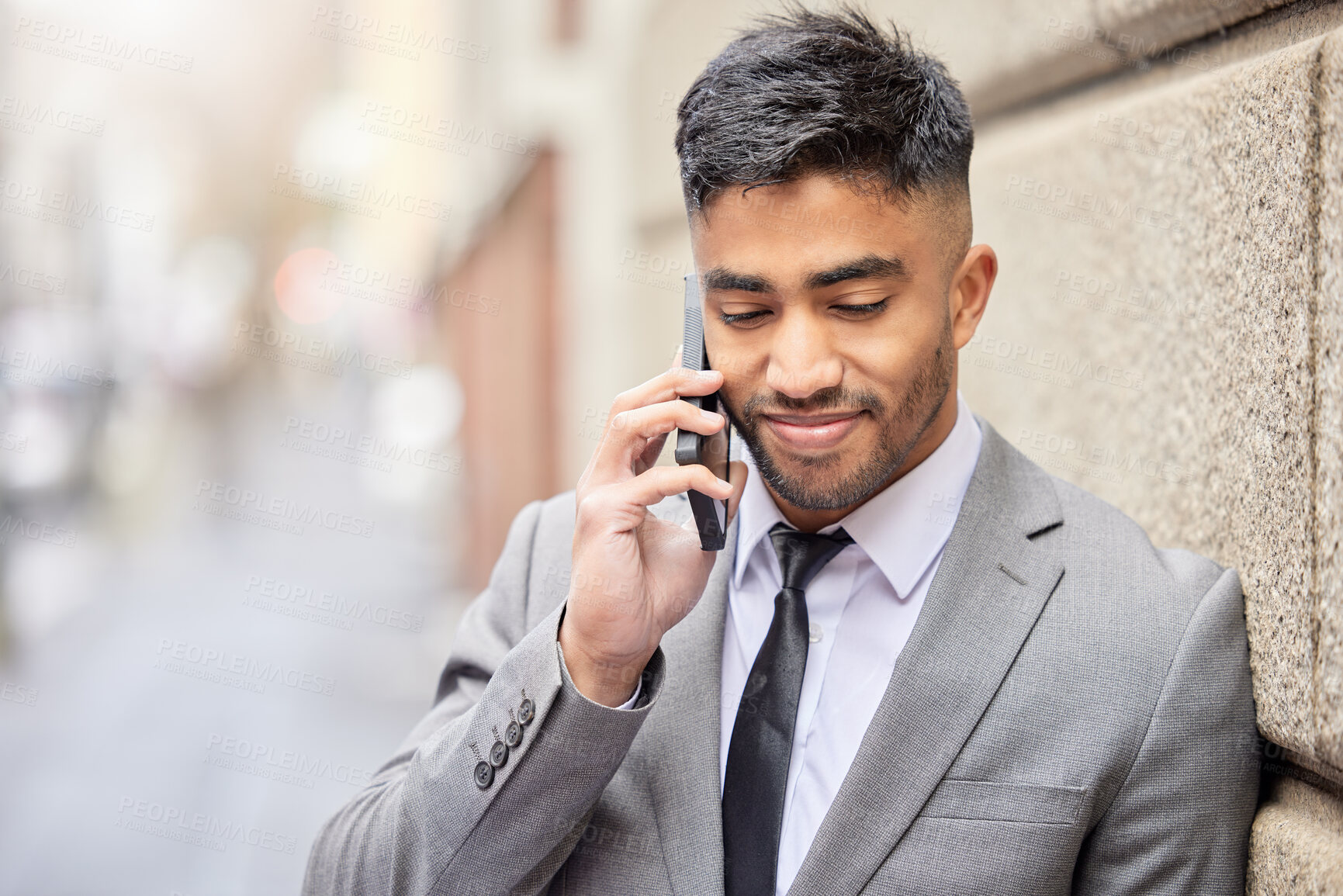 Buy stock photo Phone call, business man and wall in city for talking, conversation and salesman listening to contact for news. Mobile, Indian professional and discussion outdoor for deal, negotiation or network