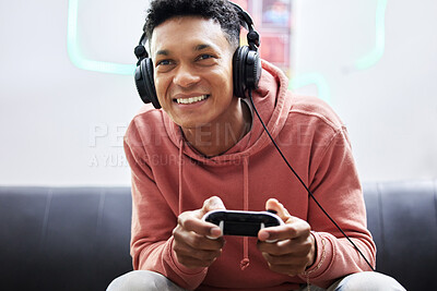 Buy stock photo Cropped shot of a handsome young man playing video games at home