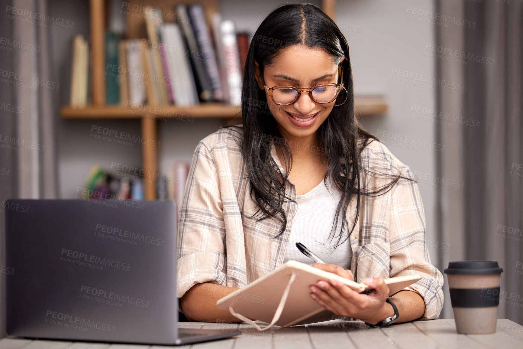 Buy stock photo Laptop, writing and education with a student woman in a university library to study for a final exam. Technology, learning and notebook with a young female college pupil reading research material