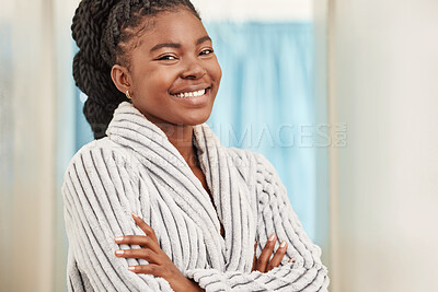 Buy stock photo Shot of a beautiful young woman standing in her bathrobe at home