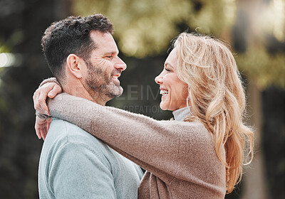 Buy stock photo Shot of an affectionate mature couple standing outside