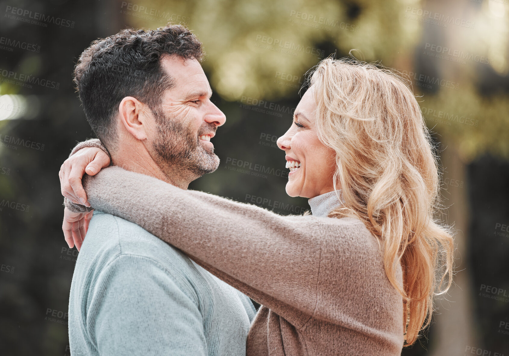 Buy stock photo Shot of an affectionate mature couple standing outside