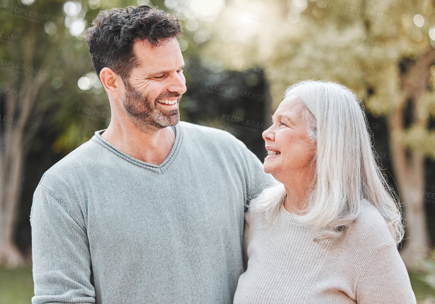 Buy stock photo Hug, man and senior mom in garden with smile, gratitude and care with outdoor bonding together. Love, elderly mother and adult son in backyard with embrace, support and happy family laughing in park