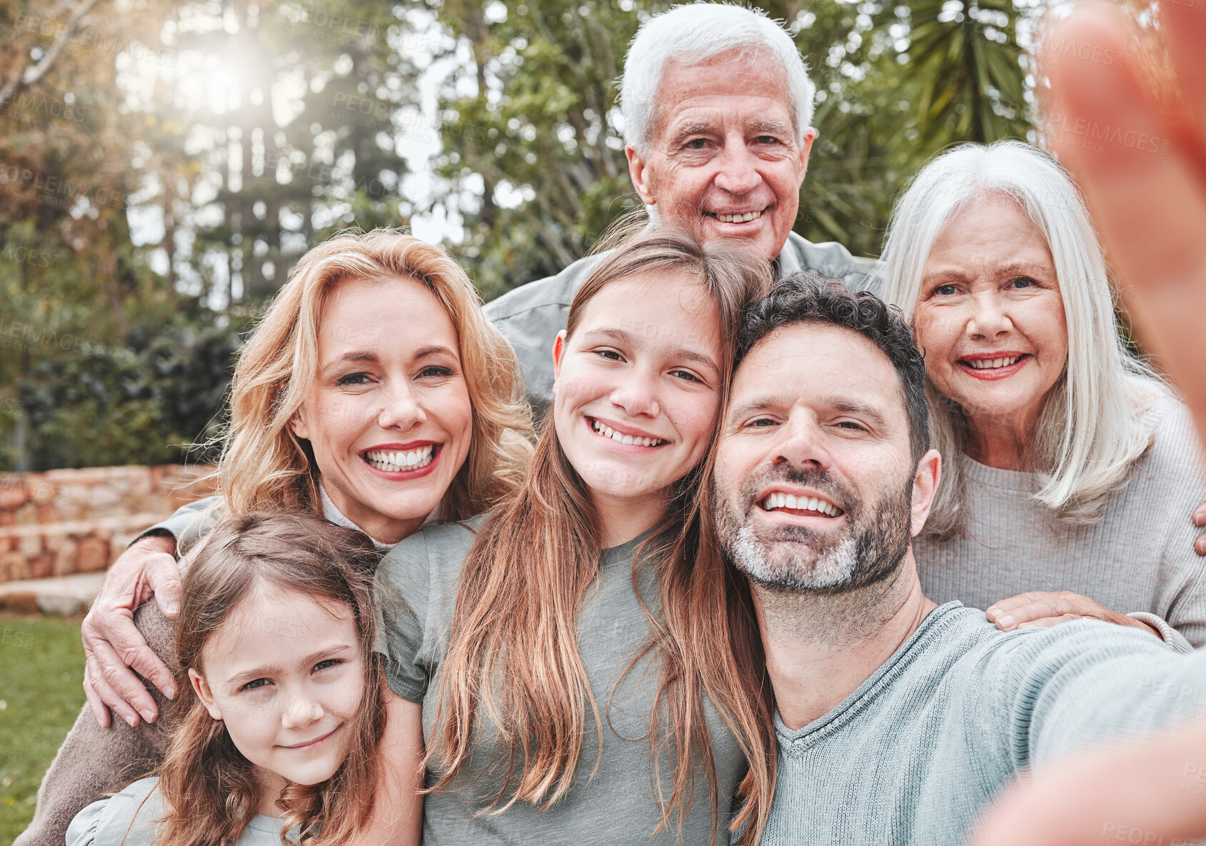 Buy stock photo Big family selfie, smile and portrait in park with happiness, love and bond for social media, app or internet post. Father, mother and daughter with grandparents, profile picture or backyard garden