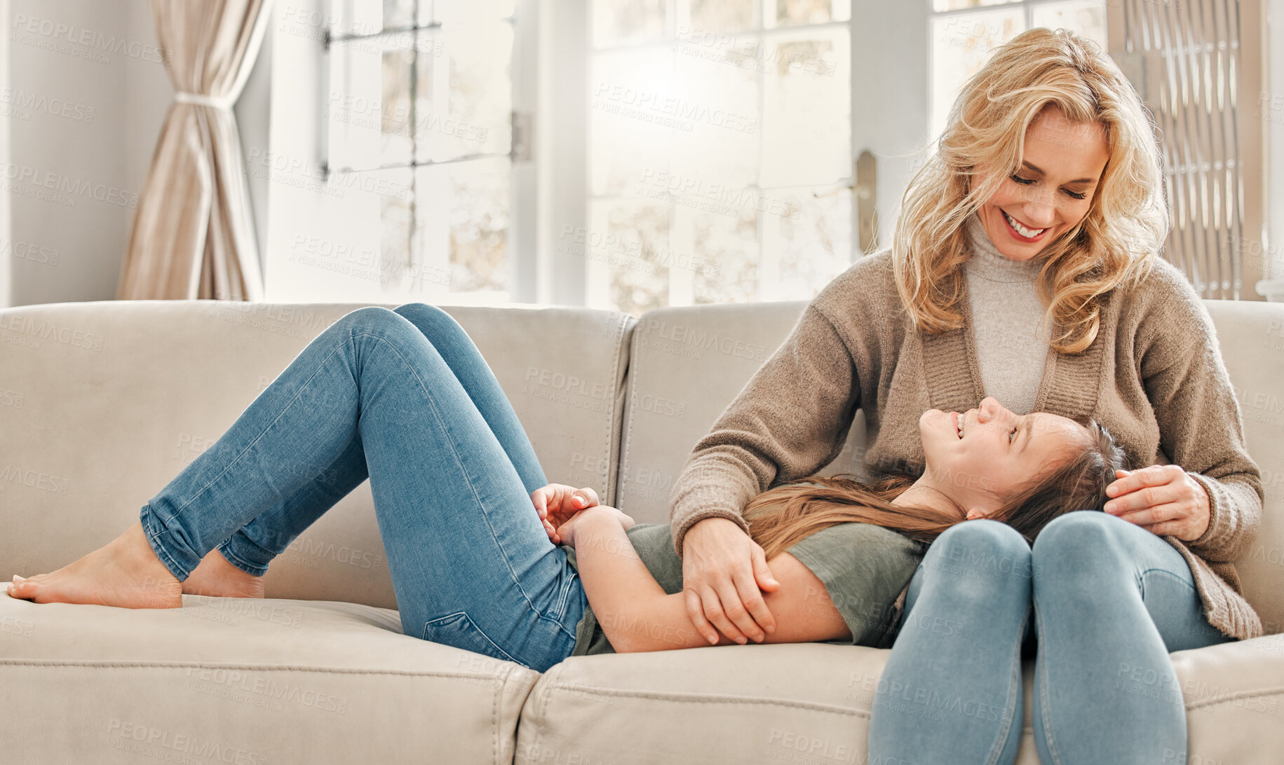 Buy stock photo Mother, child and relax on sofa with love for bonding, support and relationship connection in living room. Happy, woman and girl with hug for physical comfort, trust and security together at house