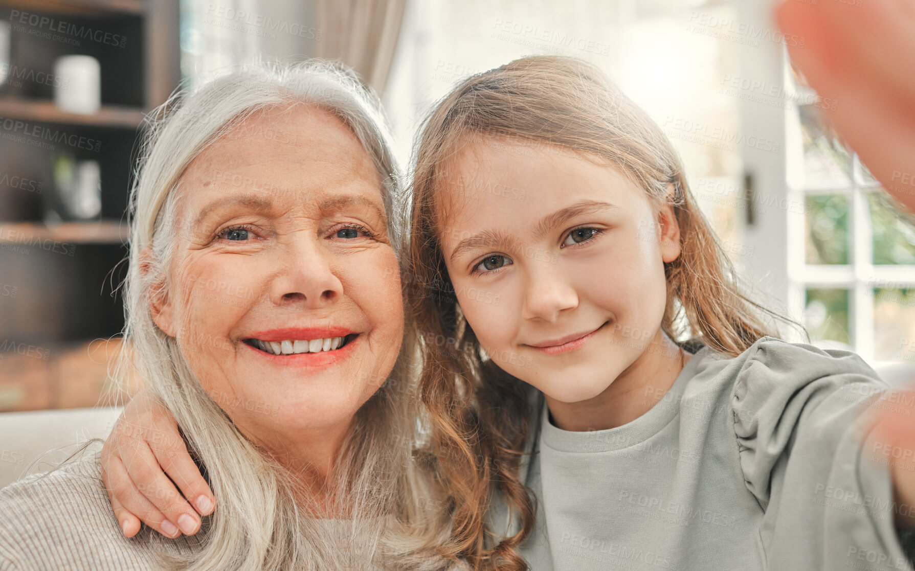 Buy stock photo Home, selfie and grandmother with girl, smile and profile picture with happiness, bonding together and relax. House, granny and grandchild in living room for joy post, social media and love portrait