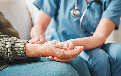 Buy stock photo Shot of a nurse checking the pulse of her elderly patient