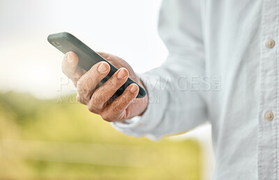 Buy stock photo Man, phone and hand for communication in outdoor, social media surfing and online for browsing. Male person, app search and nature to relax by typing message, internet connection and website for info