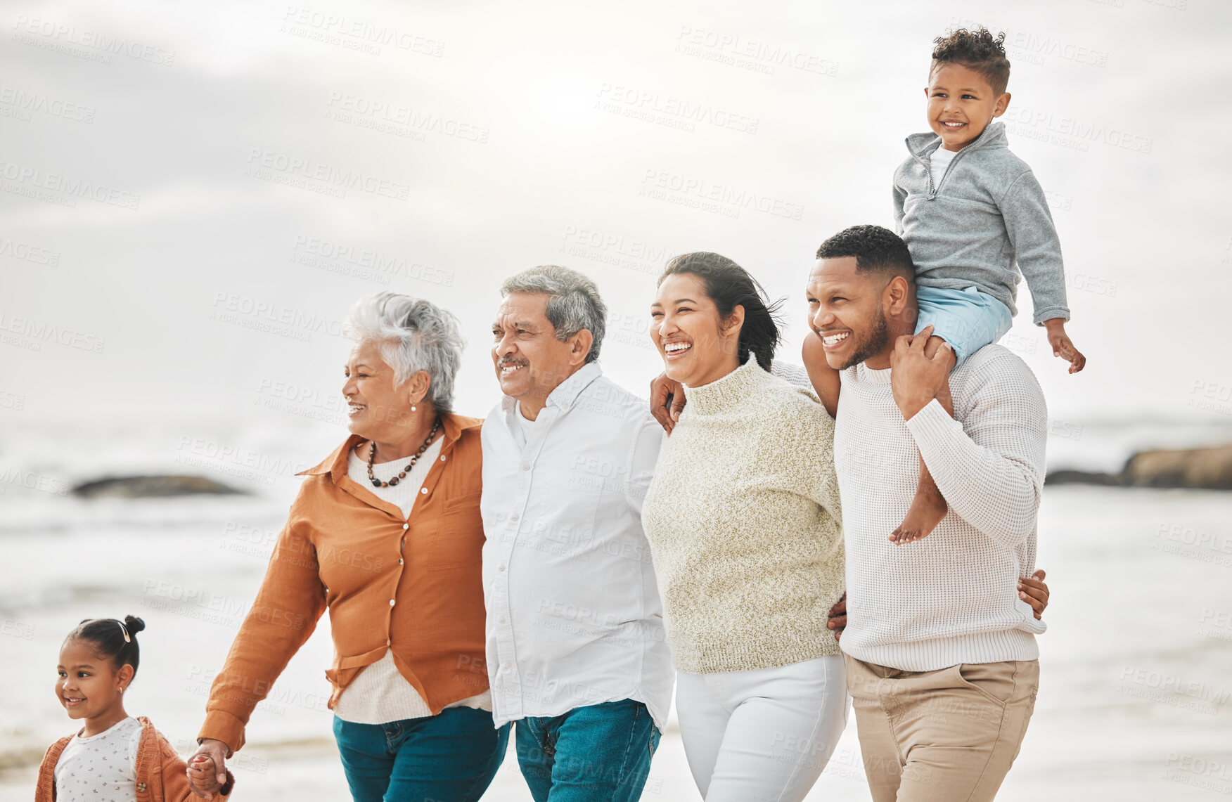 Buy stock photo Happy, family and beach walk with grandparents, mom and dad with kids together on holiday. Fun, smile and generations with vacation and break by sea with love, parent care and bonding with travel