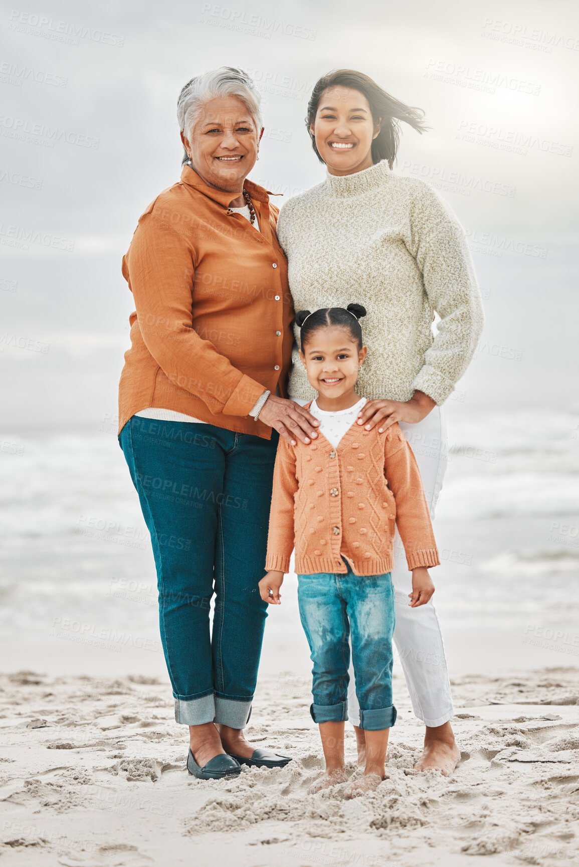 Buy stock photo Grandmother, mom and girl with portrait on beach for vacation together, love and outdoor bonding. Generations, women and child by ocean for holiday travel with support, adventure and happy in Mexico