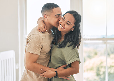 Buy stock photo Happy couple, kiss and hug in home of love, intimacy and relax for romance, bonding and trust together. Young man, woman and kissing partner for quality time, care or happiness in loving relationship
