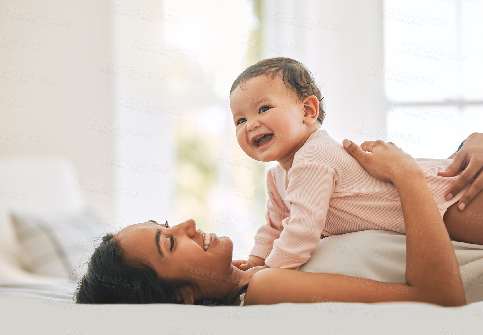 Buy stock photo Mother lying, embrace newborn baby and bed with smile, care or happiness in morning with love, bond or excited face. Young mom, kid and happy in bedroom, family home or holding with pride in sunshine