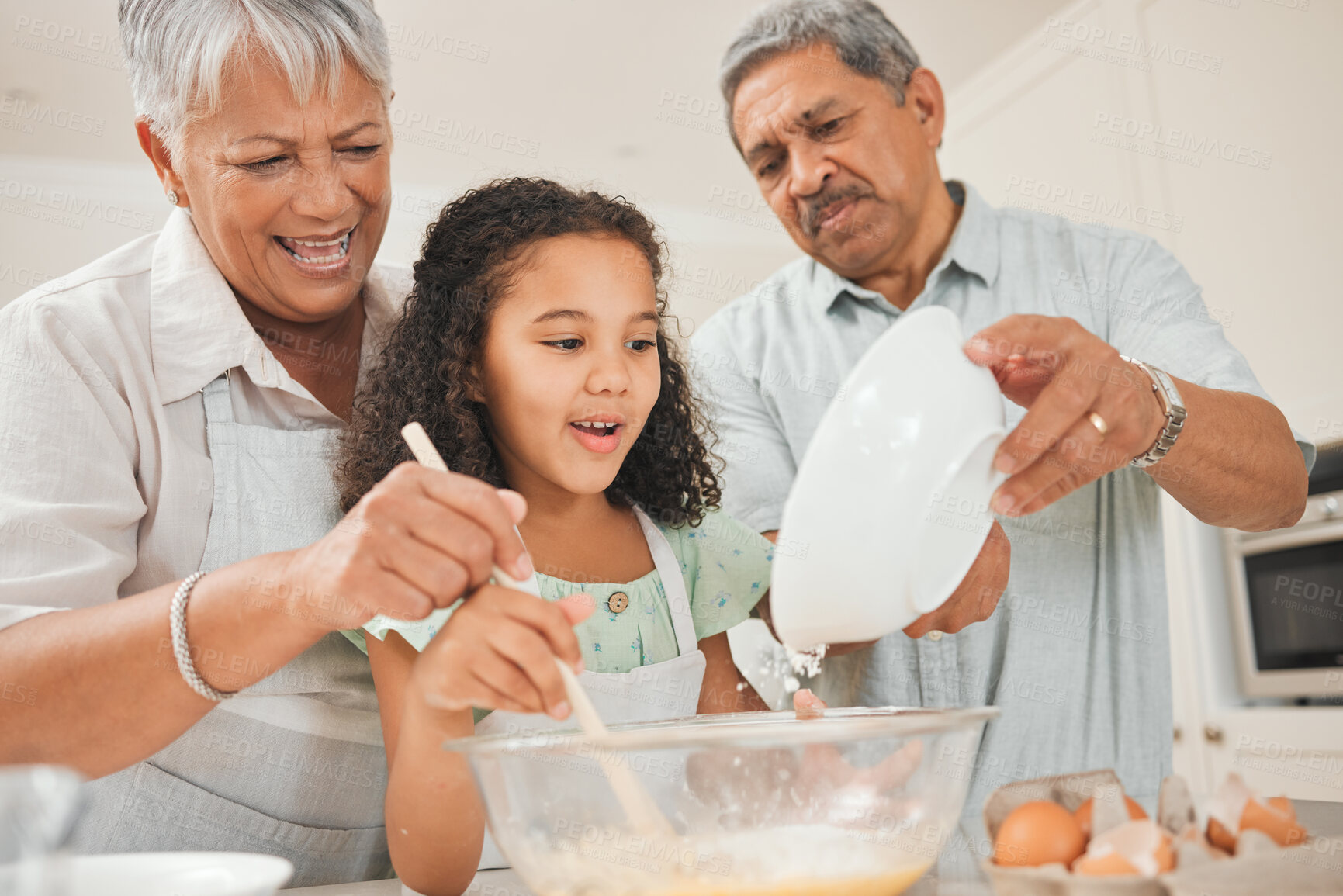 Buy stock photo Learning, child and grandparents with baking in kitchen for helping, mixing and teaching cake recipe in home. Family, senior people and girl kid with flour ingredient for cooking education or support