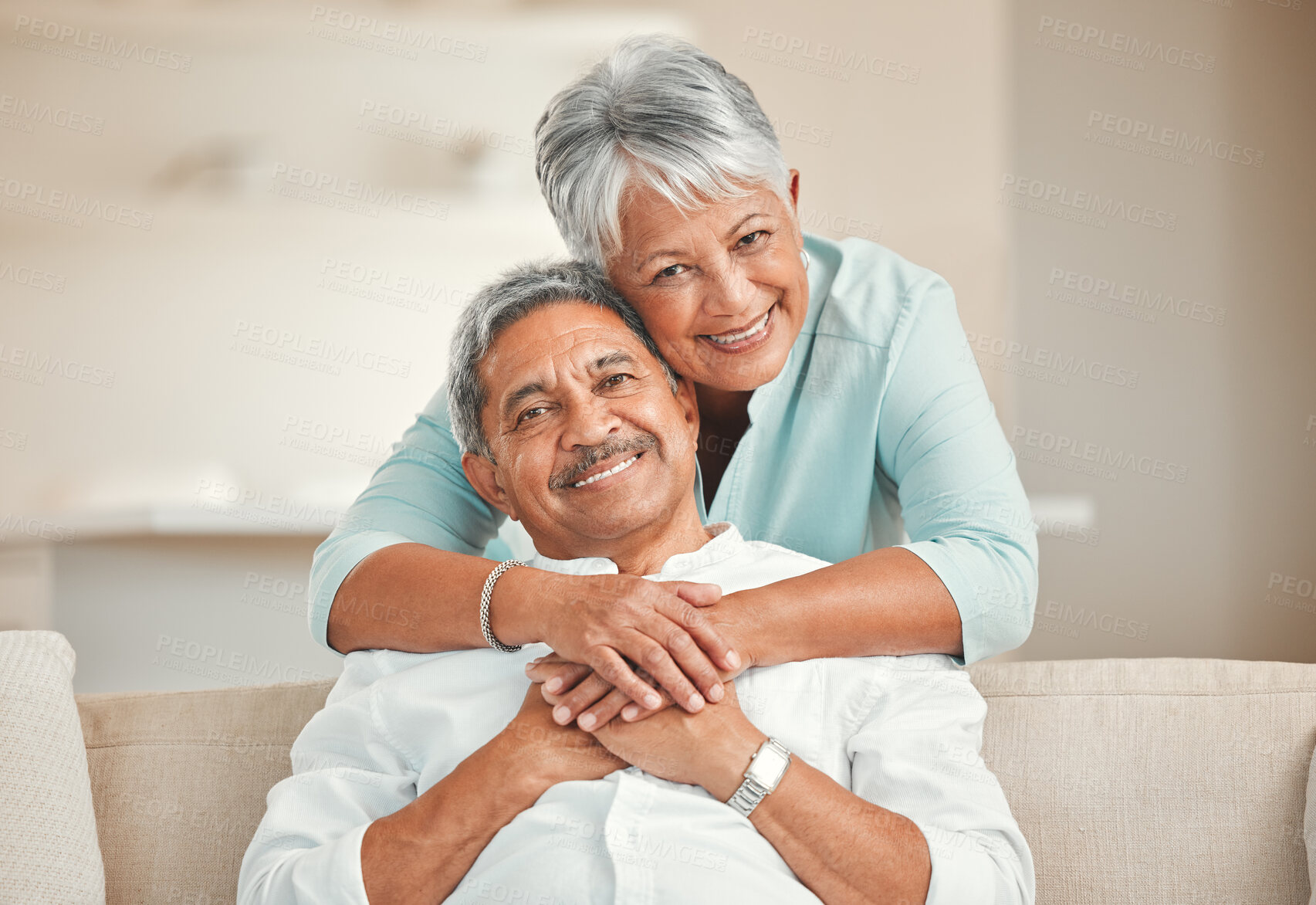 Buy stock photo Senior couple, sofa and portrait with hug, smile and love in home living room with care, romance and happiness. Elderly man, old woman and embrace by lounge couch in retirement together in house