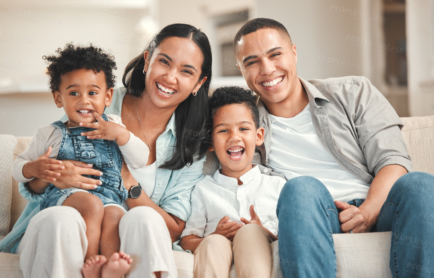 Buy stock photo Parents, kids and happy in home at living room on portrait for fun, support and care. People, family and smile on sofa for bonding with siblings for childcare or child development on break and relax