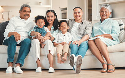 Buy stock photo Portrait of a family with their grandparents bonding together on the couch at home