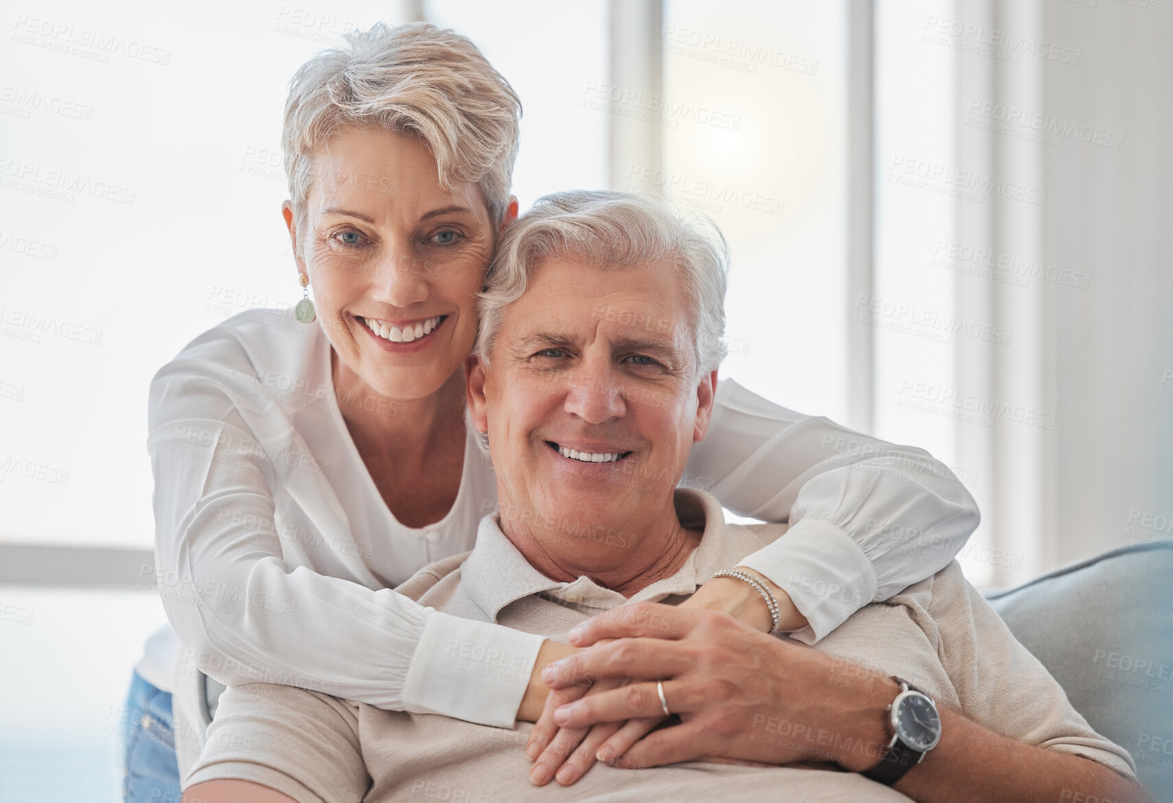 Buy stock photo Senior, couple or portrait with hug on sofa for romance, bonding or marriage commitment in home. Mature people, happy or love embrace on couch with relax for loyalty, caring or affection with support