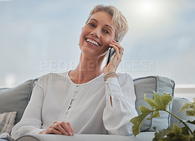Buy stock photo Cropped shot of an attractive senior woman making a phonecall while relaxing in her living room at home