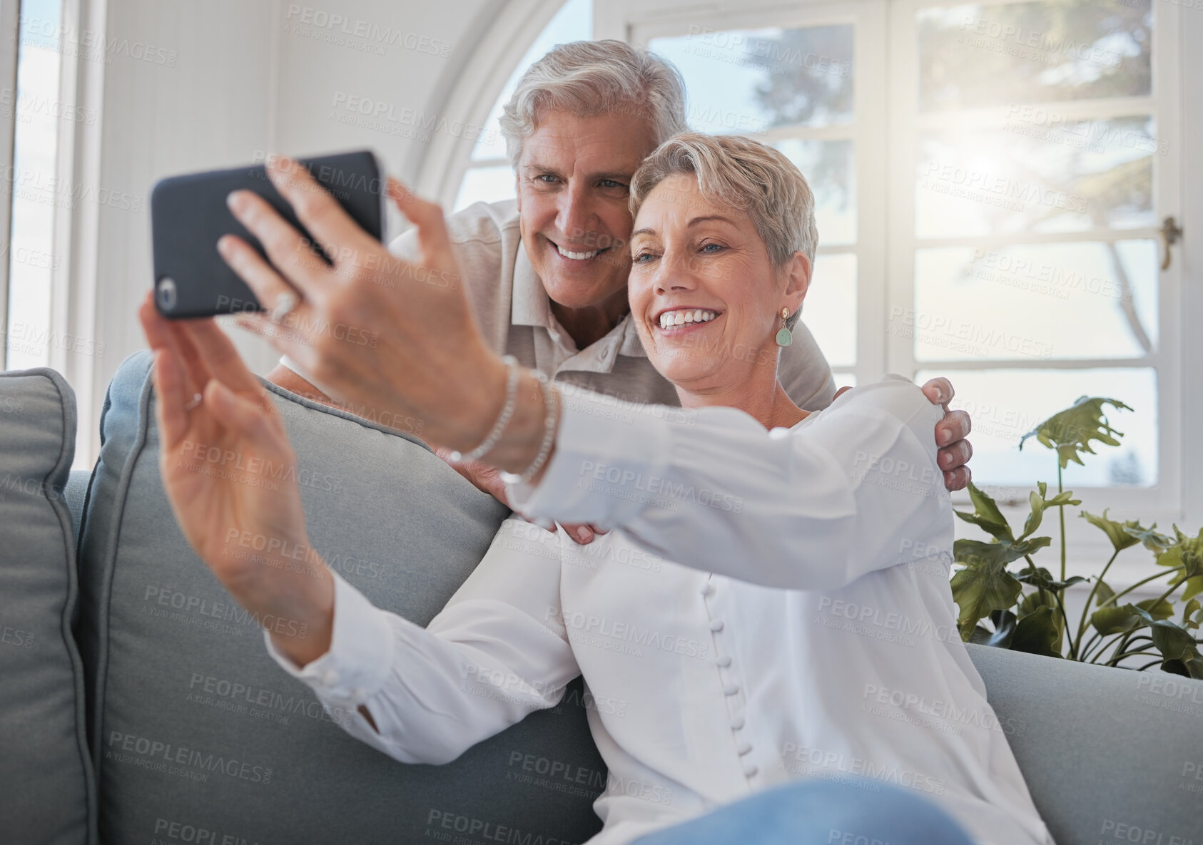 Buy stock photo Selfie, smile and mature couple on sofa for social media post, memory and profile picture. Retirement, marriage and senior man and woman on video call for bonding, love and online in living room