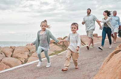 Buy stock photo Family, sea and holding hands on mountain for travel, holiday and bonding together in Greece with fun. People, ocean and walking on hill for adventure, vacation and building relationship with joy