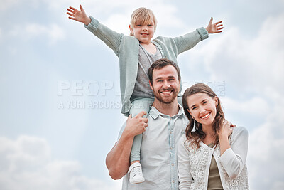 Buy stock photo Shot of a happy family enjoying a fun day outdoors