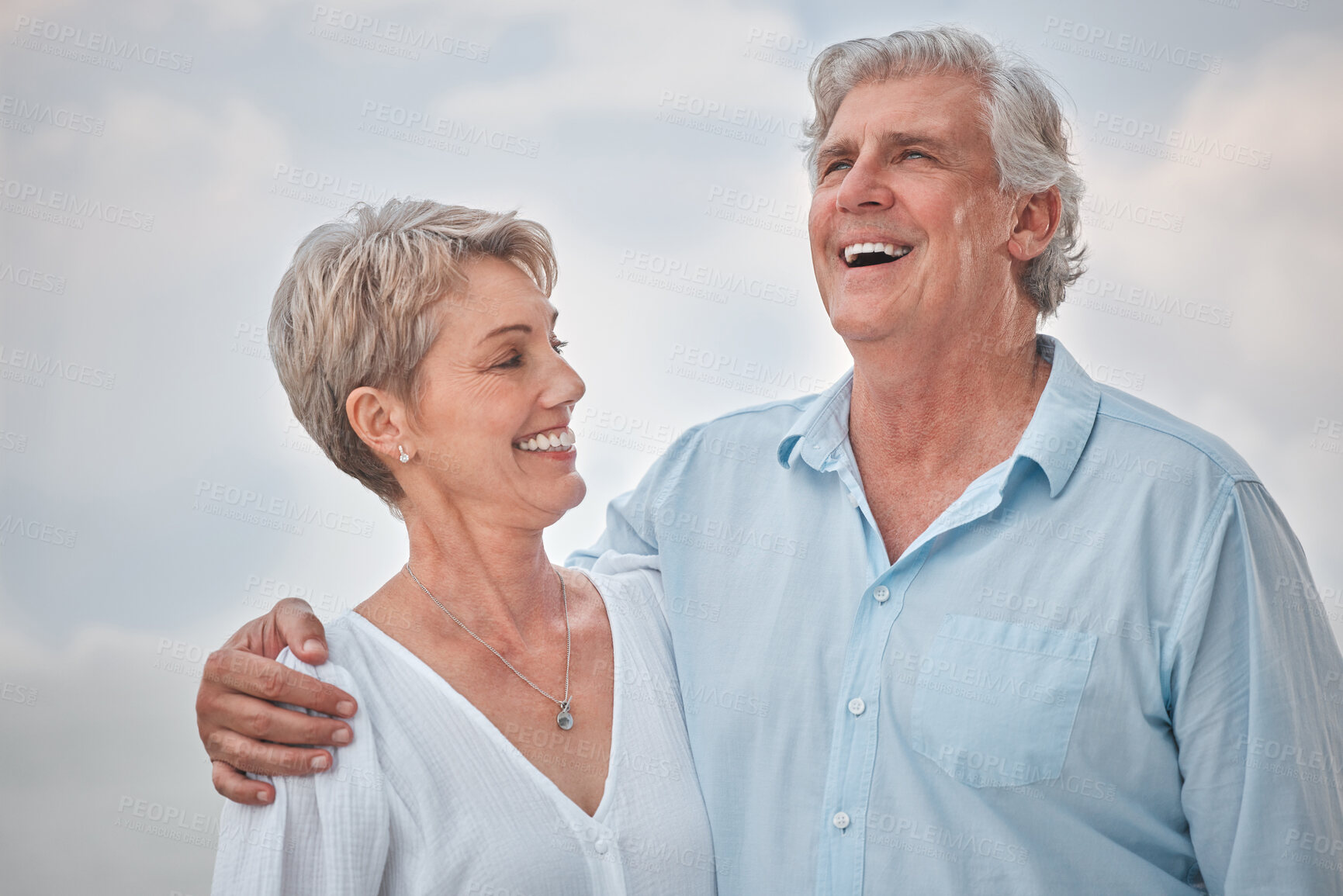 Buy stock photo Funny, hug and outdoor with senior couple, smile and retirement with happiness, coast and love. Laughing, humor and man with woman, marriage and relationship with romance, embrace and weekend break