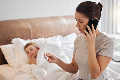 Buy stock photo Shot of a woman using a smartphone while checking her little girl’s temperature with a thermometer in bed at home